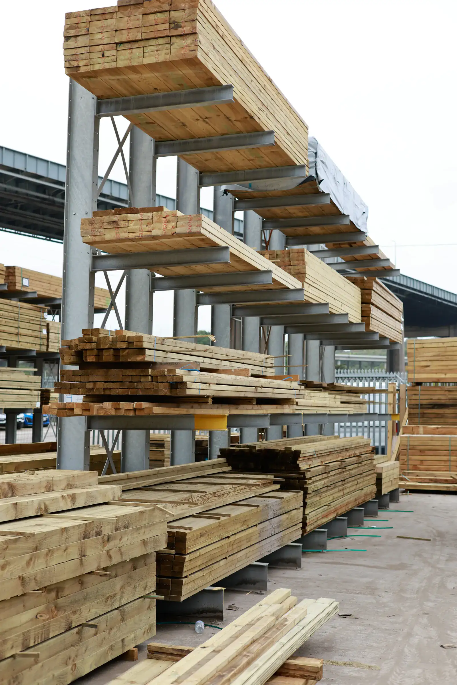 Double sided cantilever racking loaded with timber in a yard