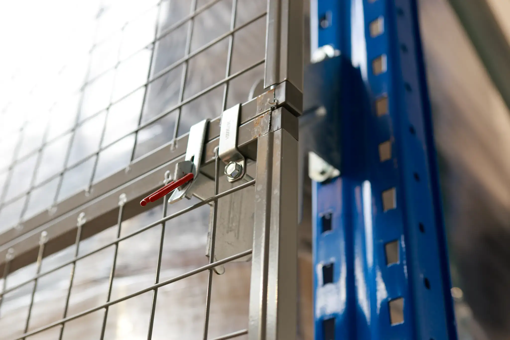 Close up of a mesh panel latch on a racking upright