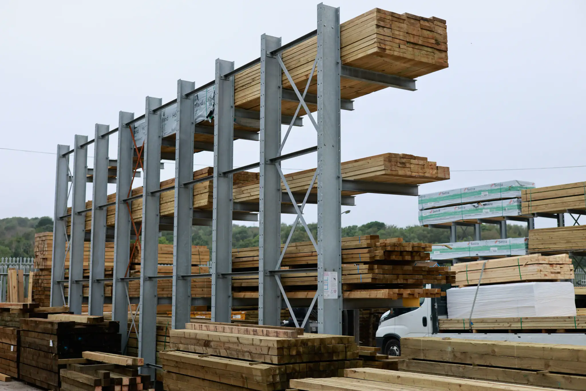 Outdoor cantilever racking storing timber in a yard